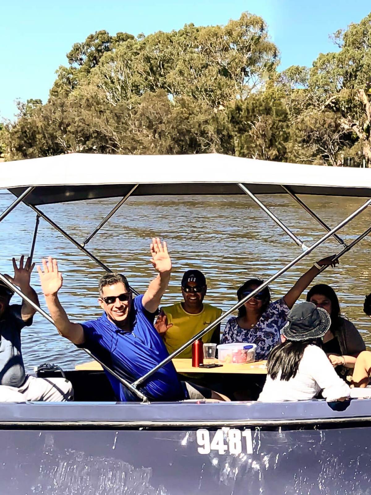 Waving on a boat