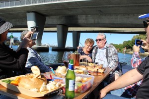 a group of people sitting at a table with food