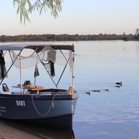 a small boat in a body of water