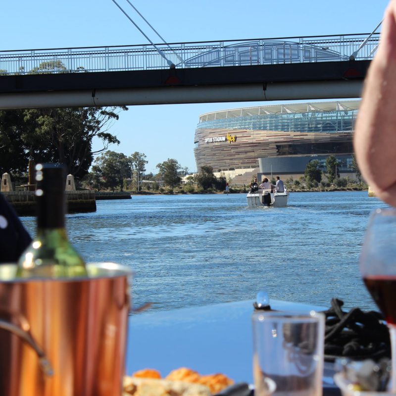 a person drinking a glass of water on a table