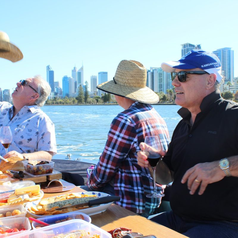 The boys out on the boat heading to Perth City