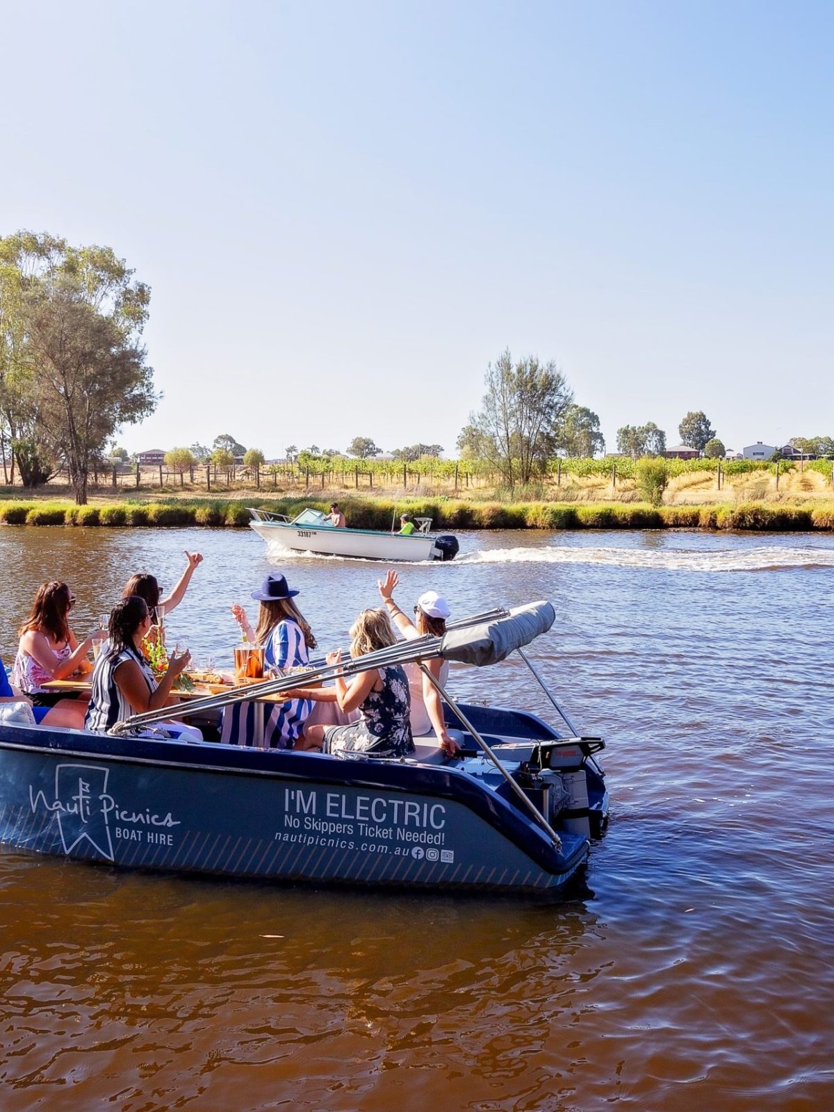 a group of people in a small boat in a body of water