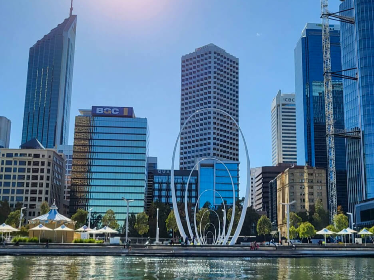 a large body of water with a city in the background