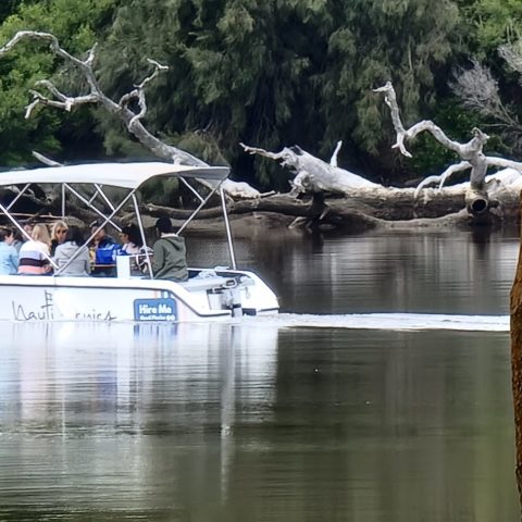 a small boat in a body of water
