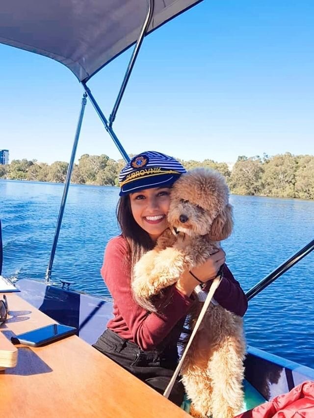 a person sitting on a boat in a body of water