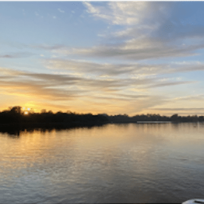 a boat is docked next to a body of water