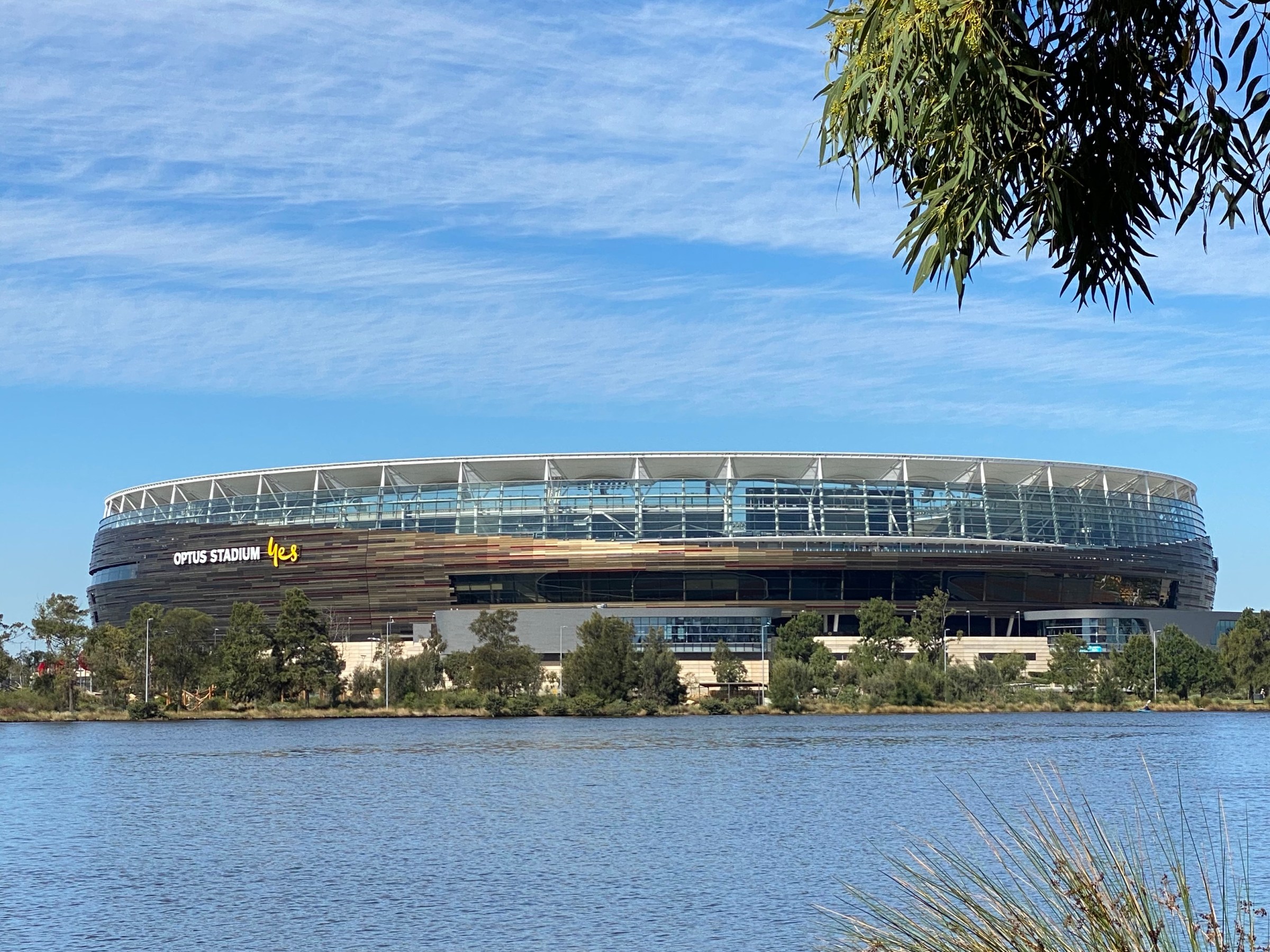 a large stadium on the rivers edge
